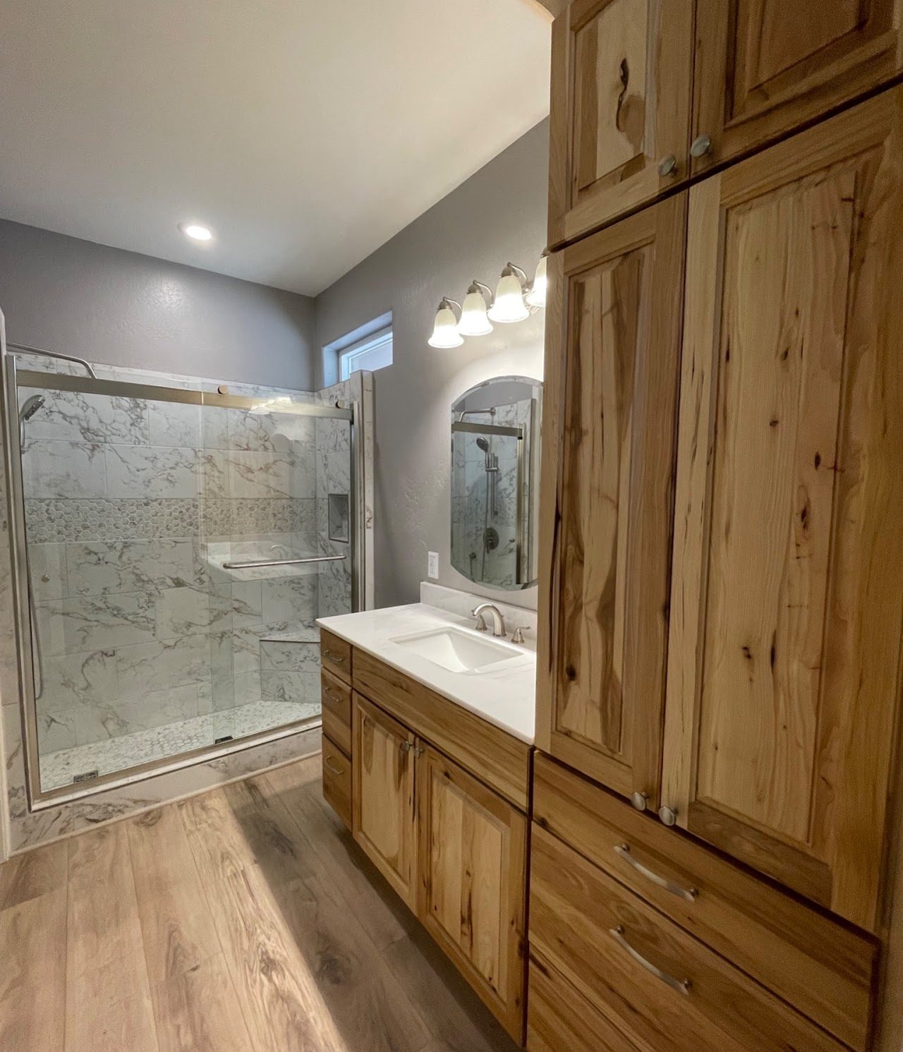 Bathroom remodel with new shower, tile, and countertop by Gila Home Solutions