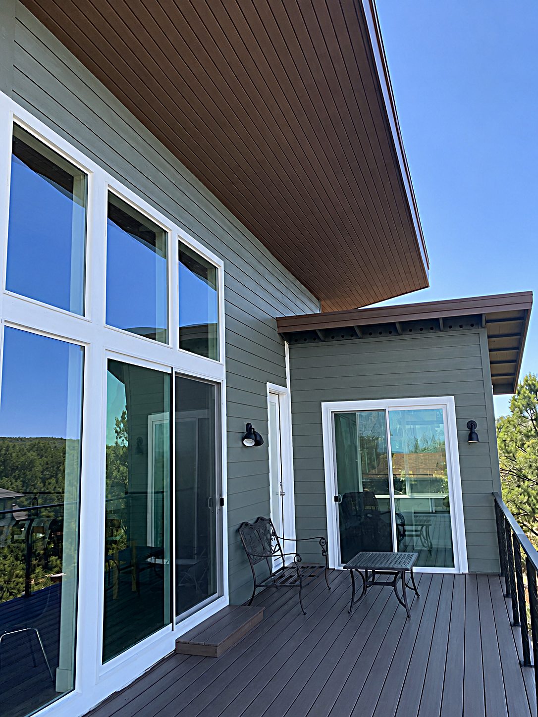 Composite decking and wall of windows on a custom home built by Gila Home Solutions in Payson, Arizona